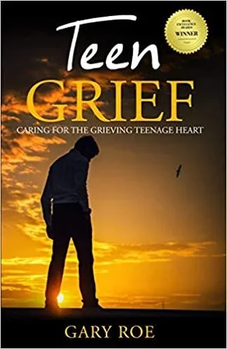 Book cover titled 'Teen Grief' by Gary Roe, featuring a silhouette of a teen boy standing at sunset with a dark sky and a bird flying in the background.