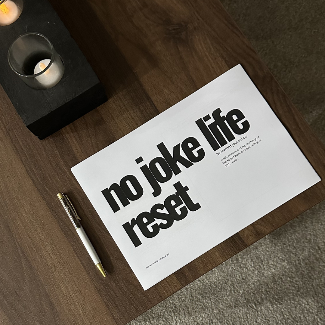 the no joke life audit reset framework printable download sitting on a wooden coffee table