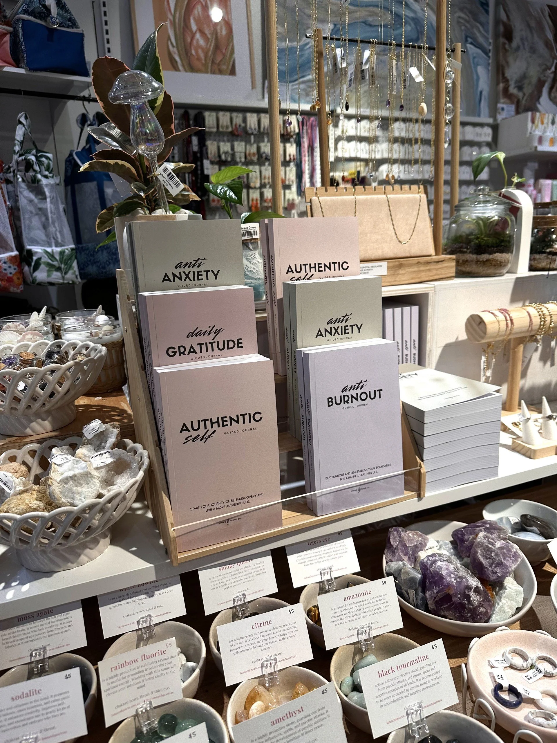 Display of authenticity journal, gratitude journal, burnout journal and anxiety journal by inward journal co, in a unique gift store in perth, wa