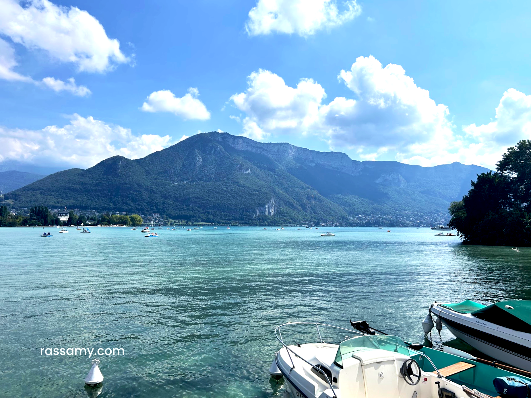 Boats docked on a busy Saturday on Lake Annecy