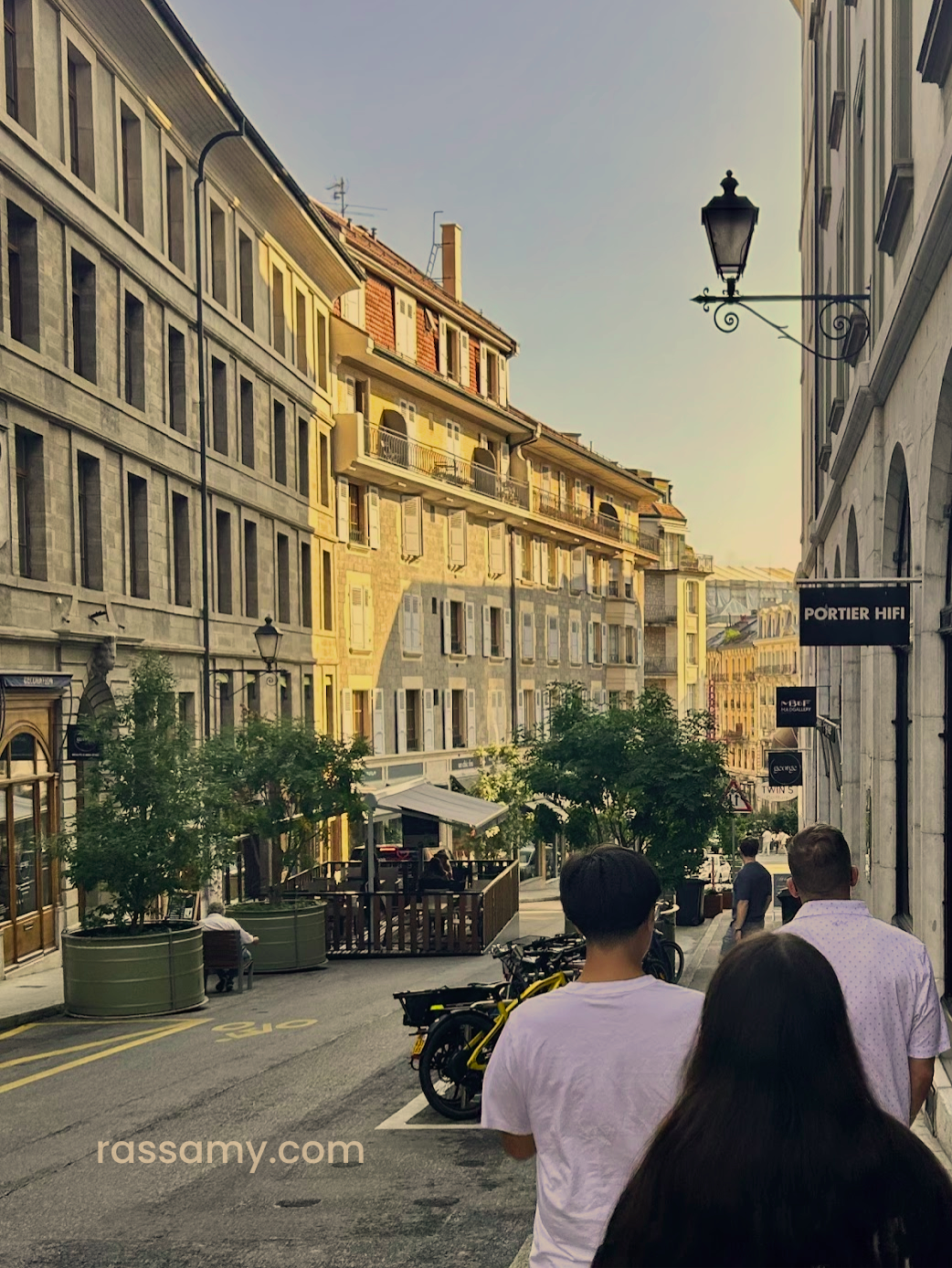 Family walking though Old Town of Geneva, Switzerland.