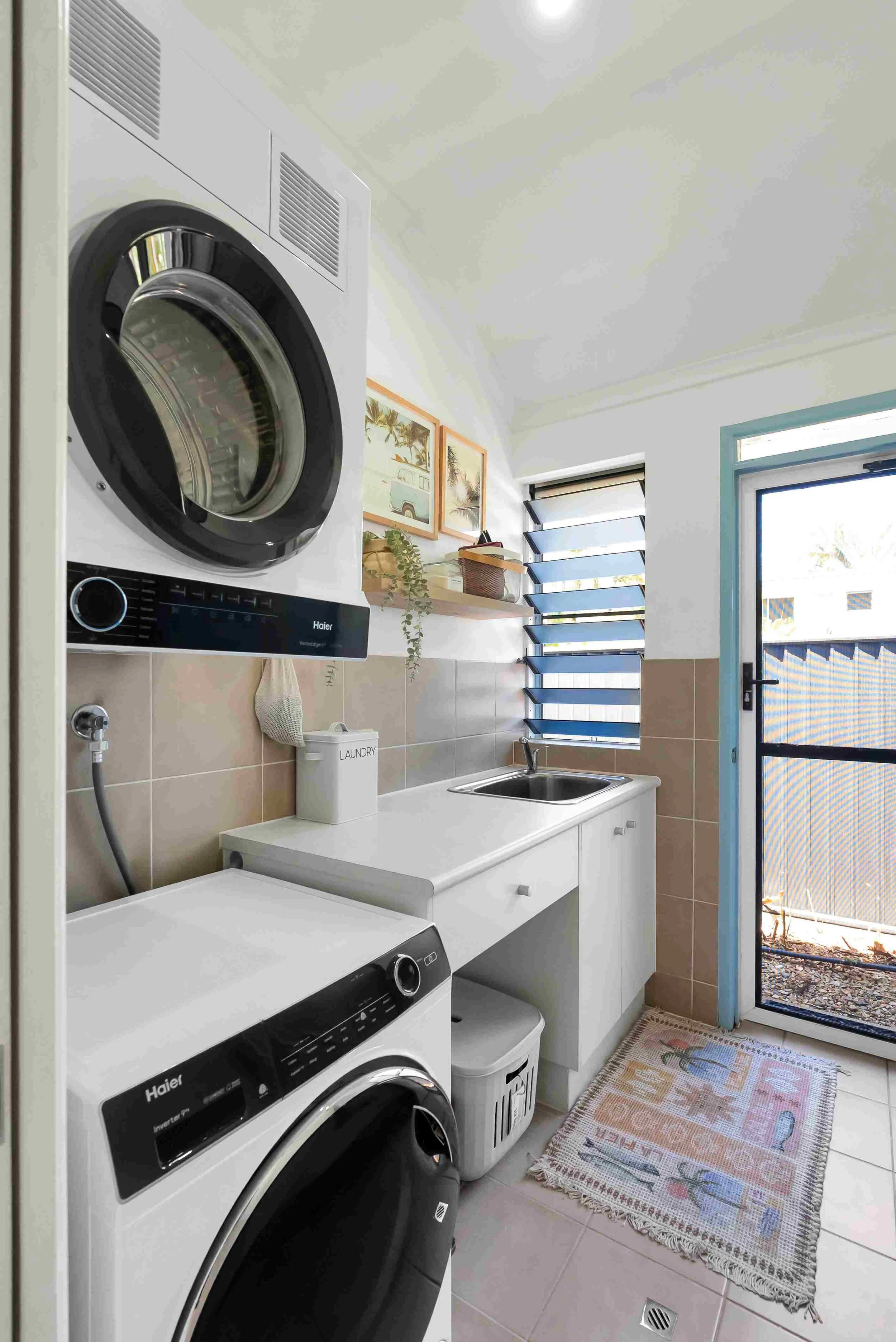 Separate laundry room with complimentary washing powder