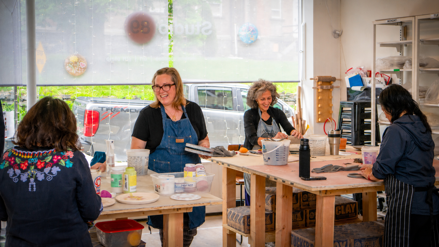 Amy Dooley in her studio with students.
