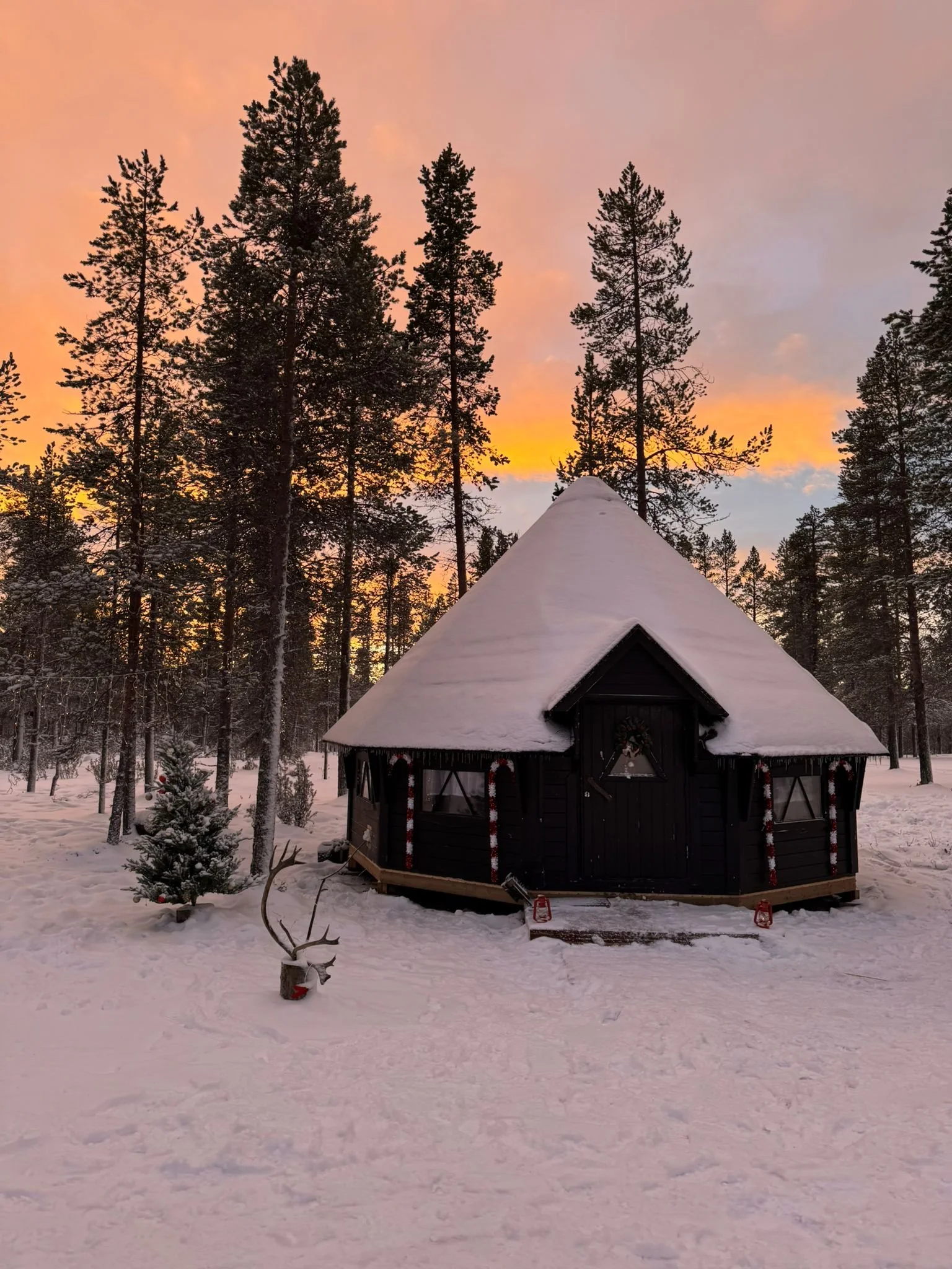 Elf village, sunset sky, Lapland trip with kids