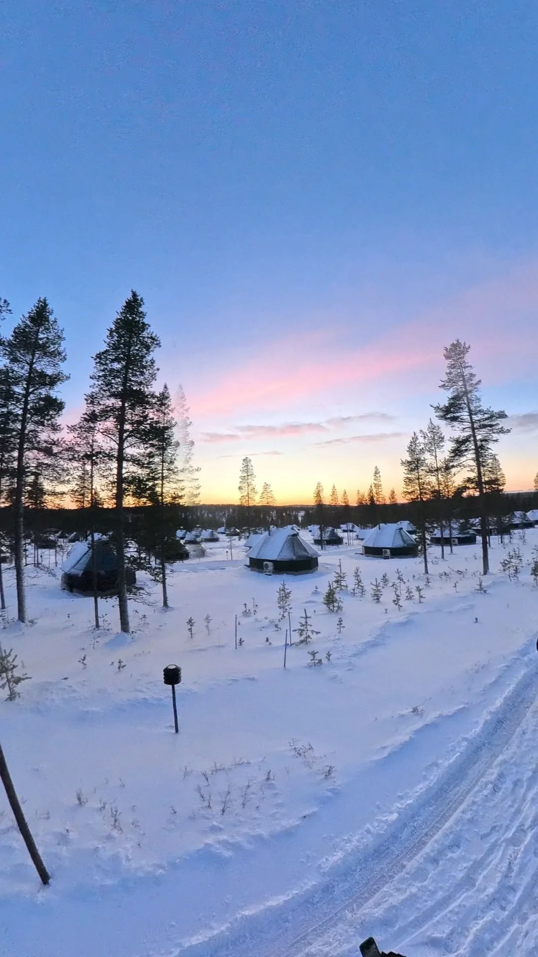 Pink snowy skies, aurora cabin, northern lights village, saariselka