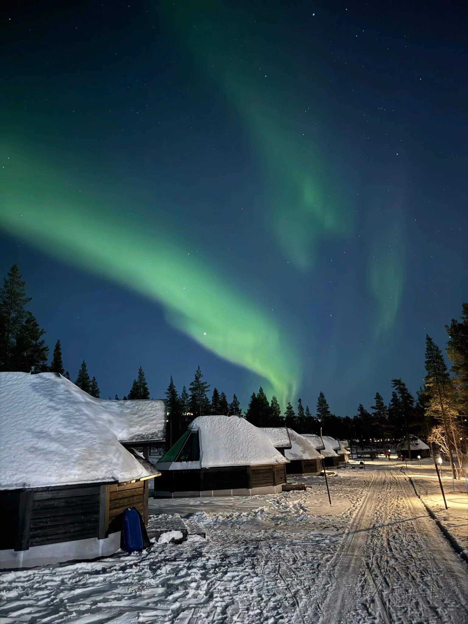 Northern Lights over cabin, Lapland trip with kids