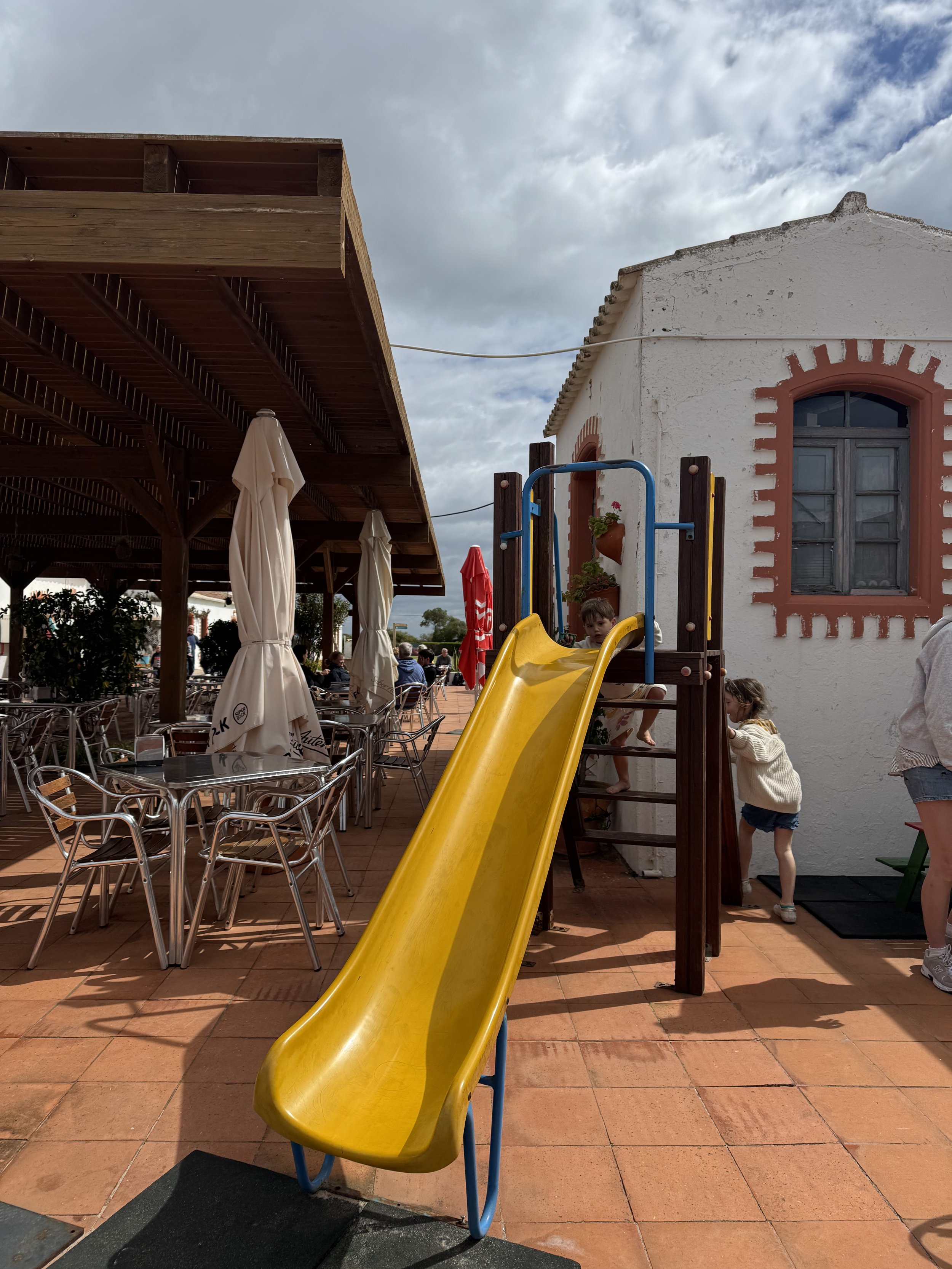 Slide at beach cafe, Praia do Barril beach boardwalk, Tavira with Kids