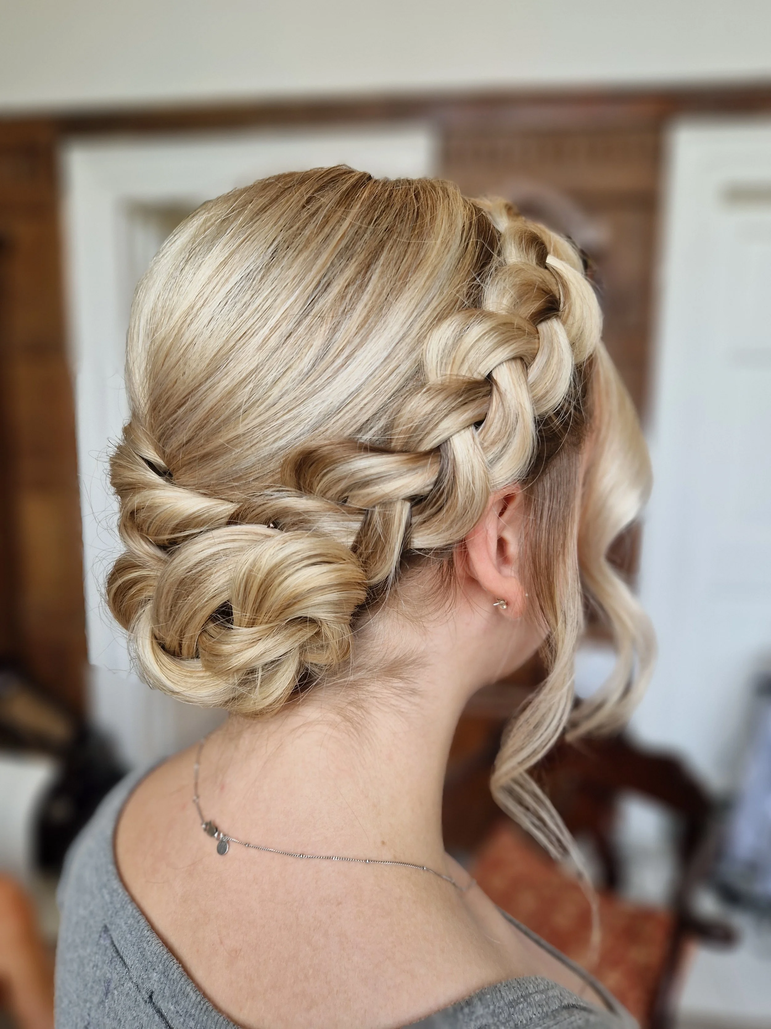 Woman with blonde braided updo hairstyle