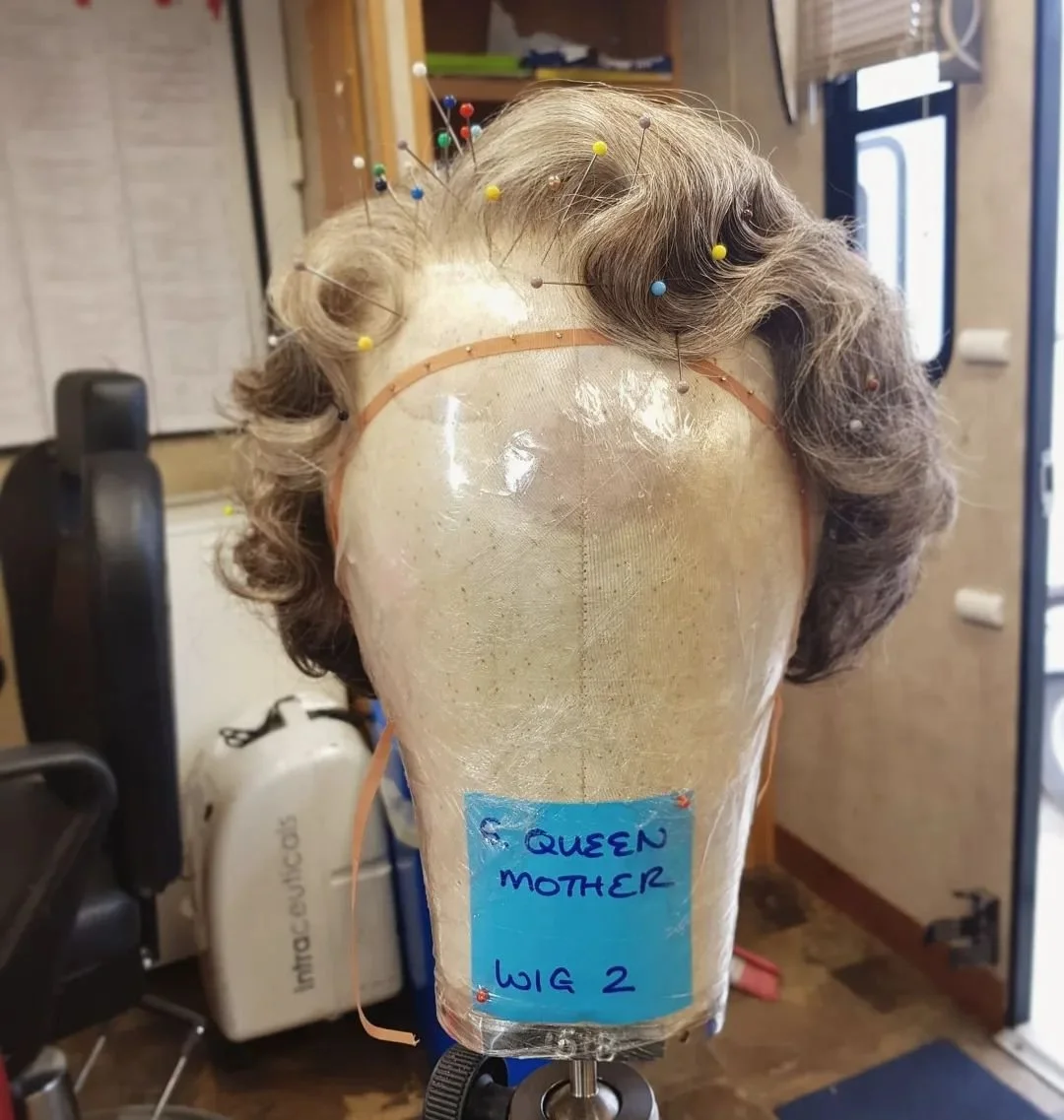 Setting and dressing the Queen Mother wig on location in Scotland for The Crown, Season 4 _ We worked from real life pictures of the Royal Family at all times throughout filming to get a true lik.jpg