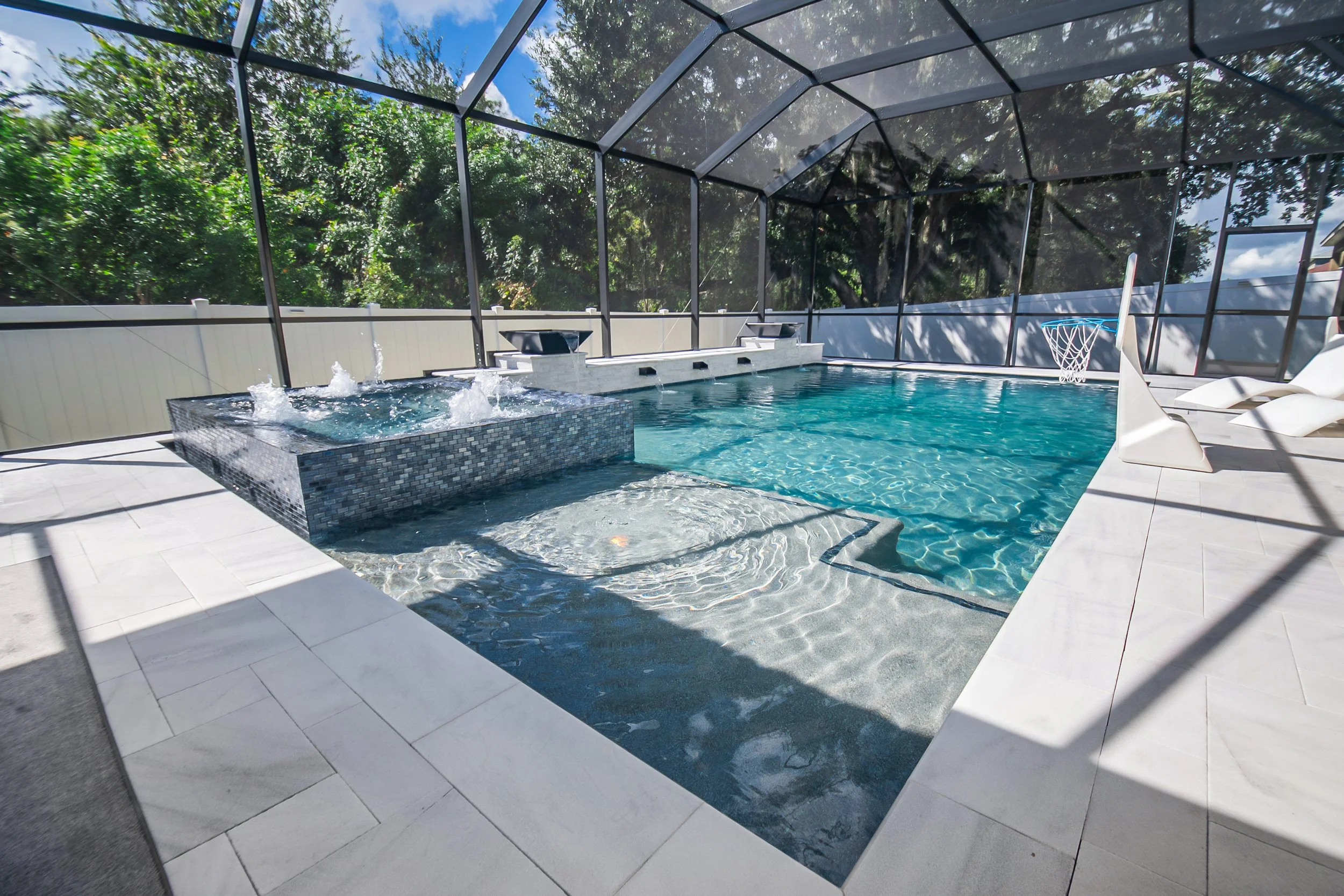 Custom Modern Design Pool with 360 Spillover Spa, French Gray Pebble Finish, Waterbowls, and Custom Scuppers