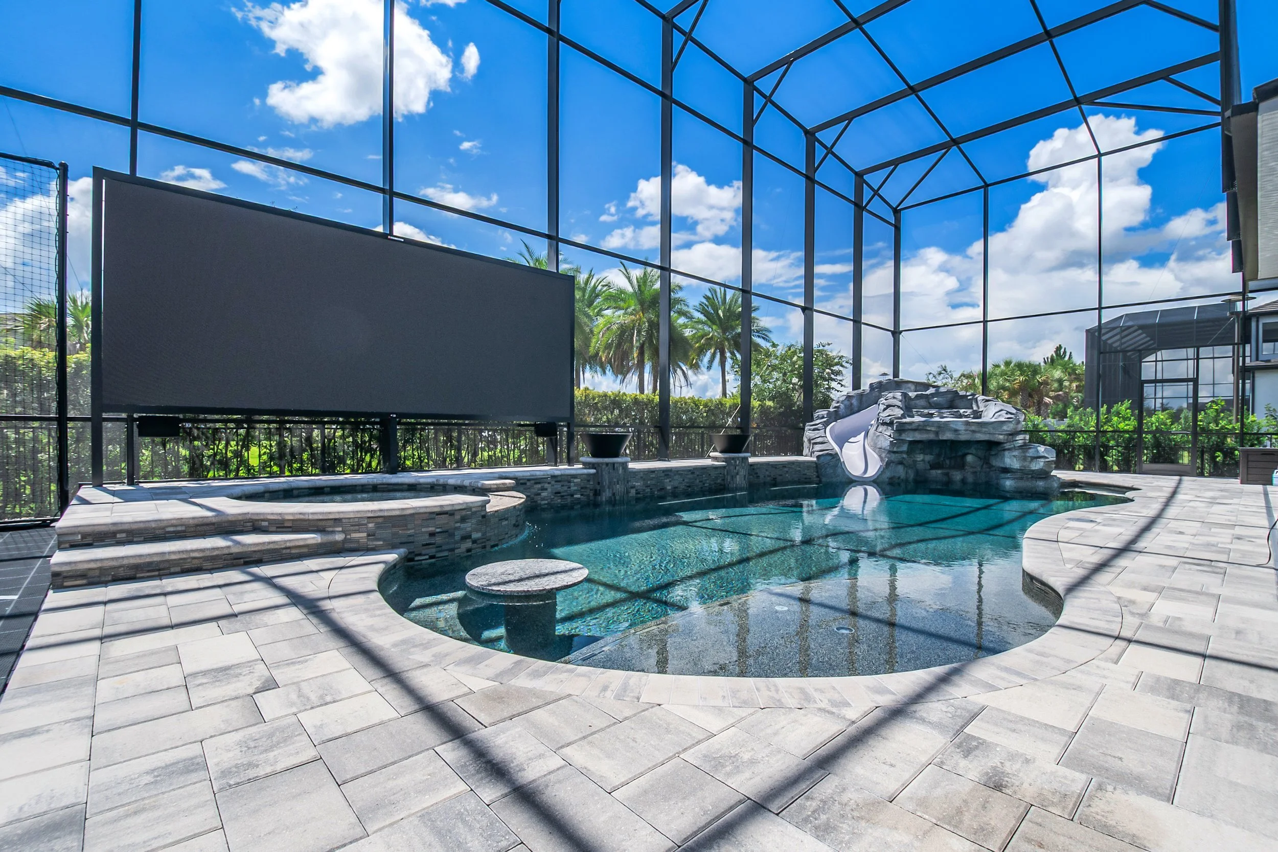 One-of-a-Kind Dream Pool with Hand-Crafted Custom Rock Grotto, Waterfall, and Slide