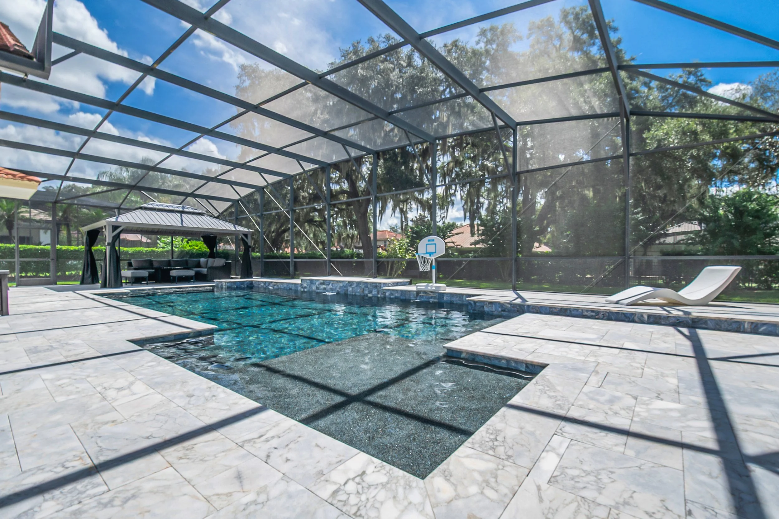 Midnight Blue Pebble and Sandblasted Marble Decking