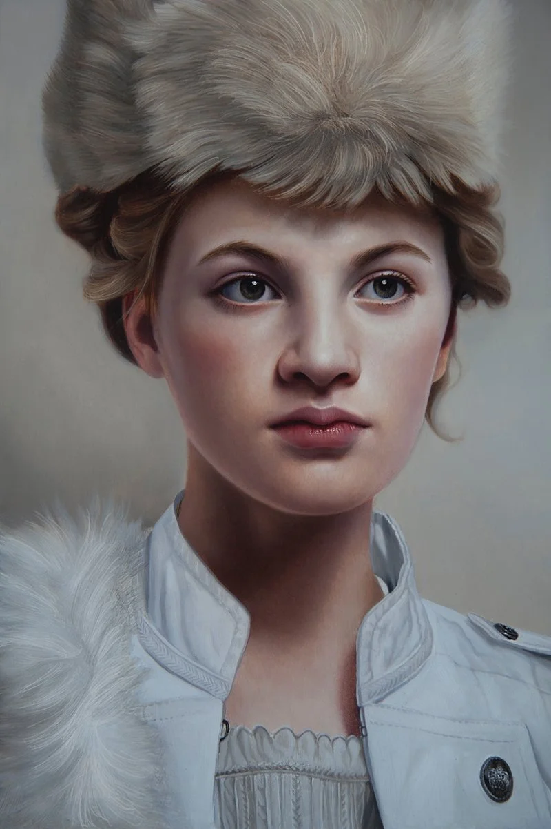 A young woman with fair skin and light blonde hair, wearing a large, fluffy fur hat and a white military-style jacket with decorative buttons and shoulder accents.