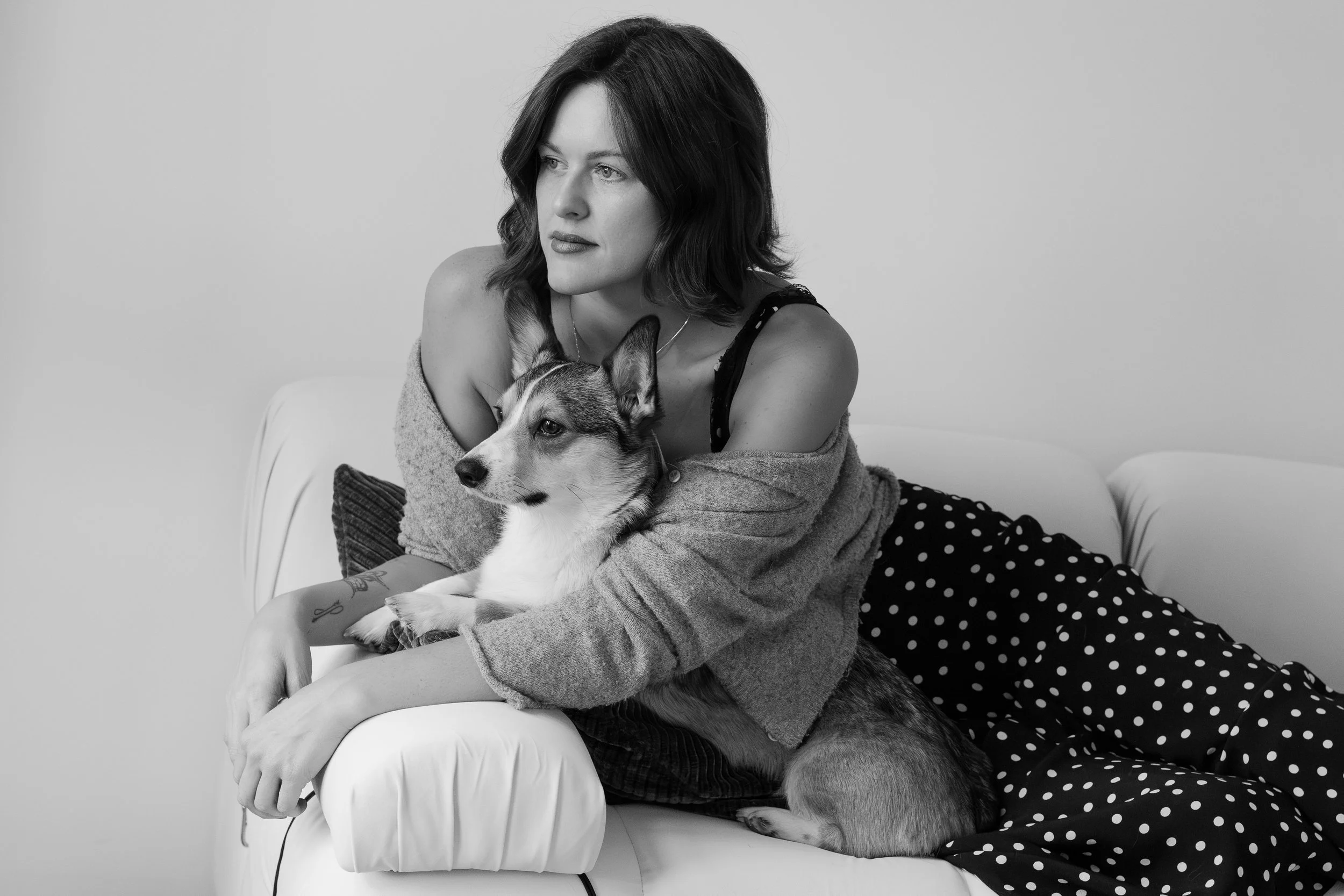 A fashion portrait of a woman and her dog