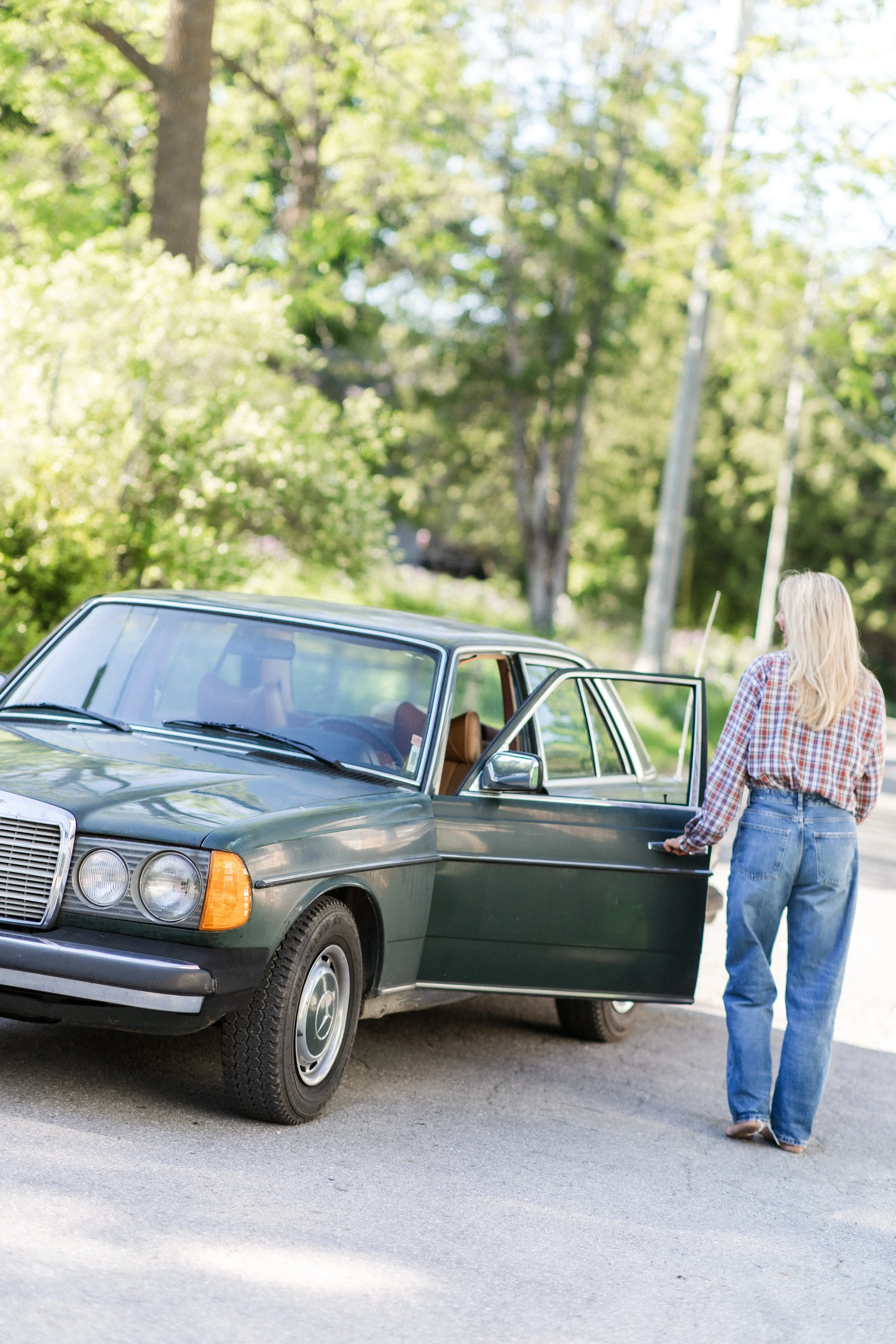 Women with her Mercedes for a branding shoot