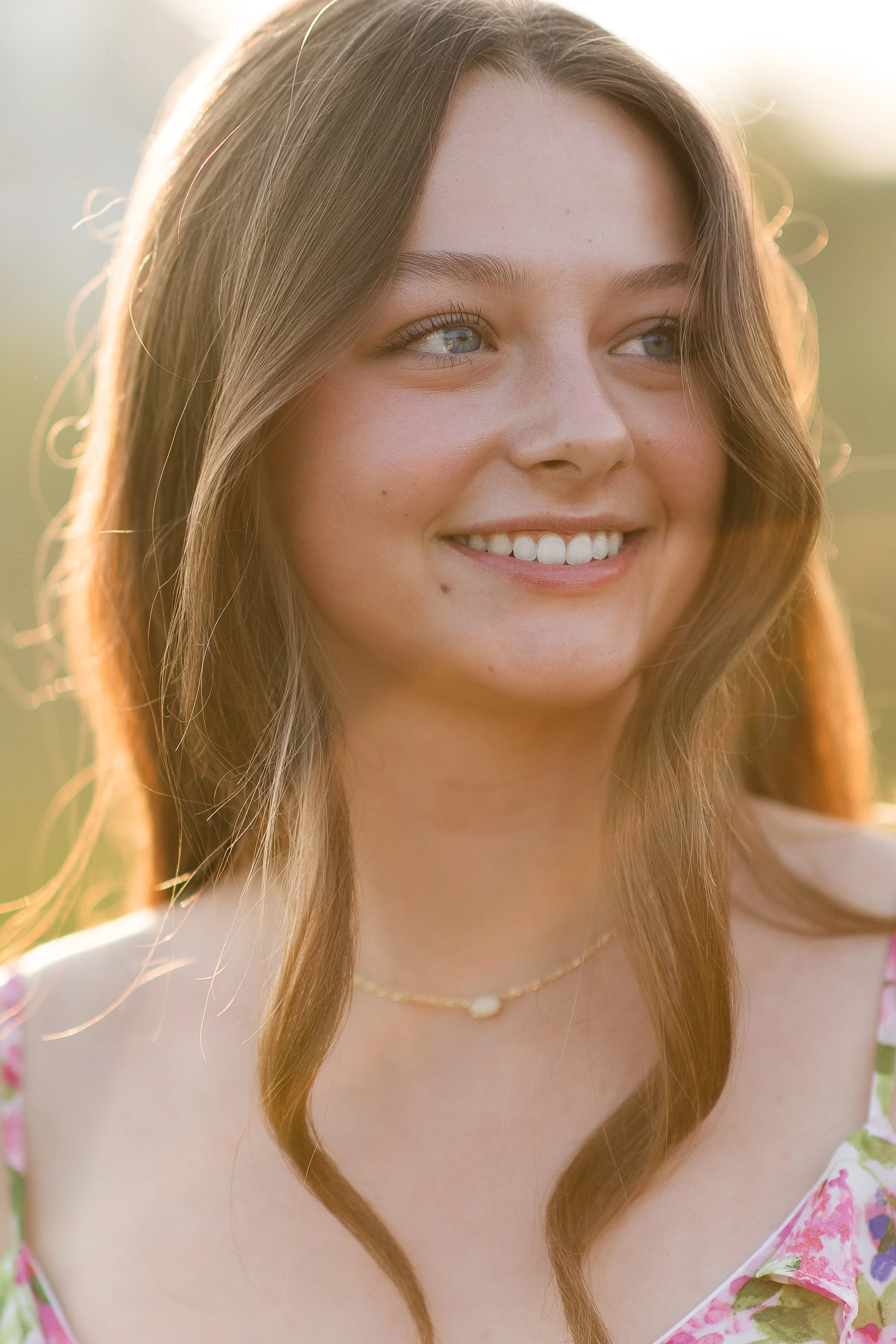 A portrait of a female senior at golden hour in northern Michigan