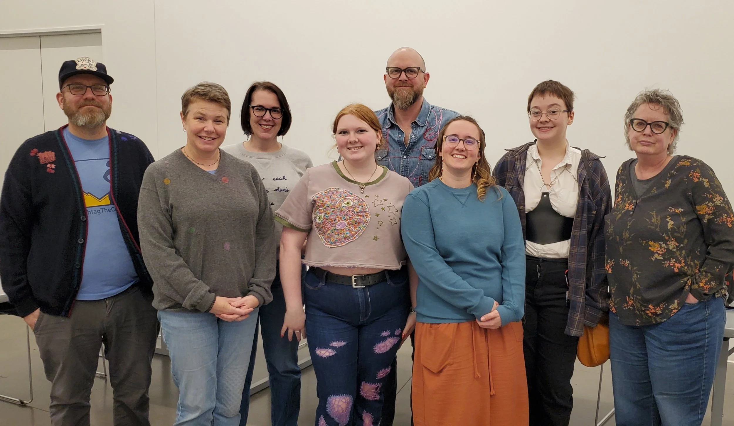 Students in Visible Mending class at Oklahoma Contemporary showing off their work.