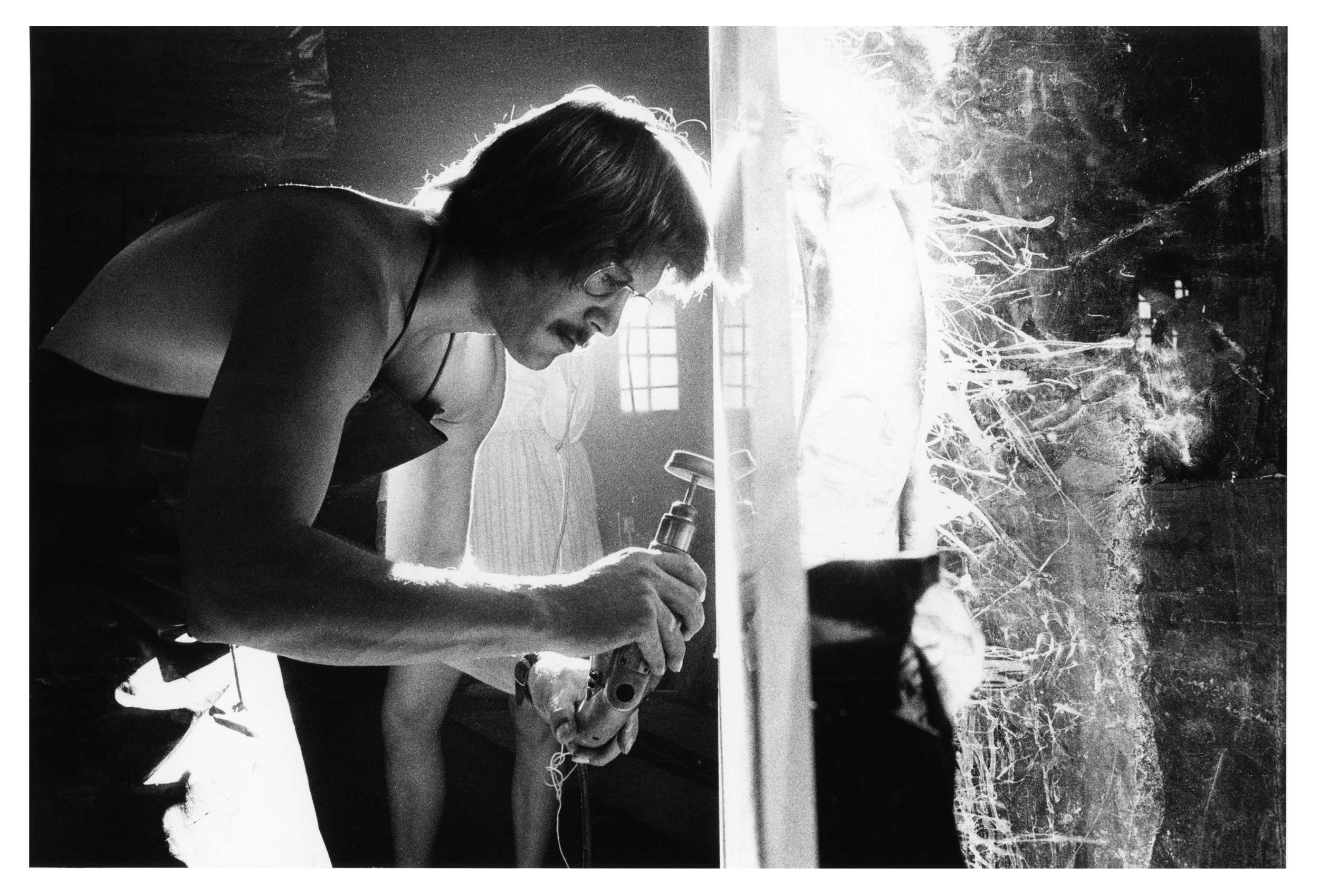 Photo © LeRoy Woodson. Photographed for the exhibition catalogue Rockne Krebs by James N. Wood, Albright-Knox Art Gallery, Buffalo, New York, 1971. Krebs in his studio working on a plexiglas sculpture, 1970.