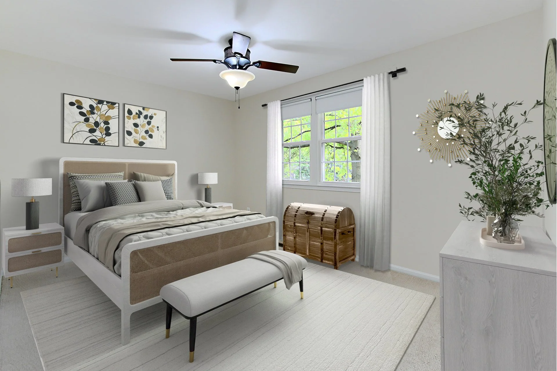 A modern bedroom with a beige bed, white bedding, and decorative pillows, two bedside lamps, a wooden storage chest near the window, and a white dresser with a plant, a wall clock, and artwork.