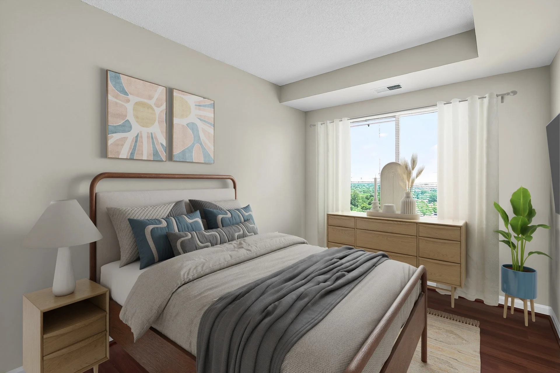 A modern bedroom with a bed, pillows, nightstand with lamp, dresser with decorative items, window with curtains, a potted plant, and framed artwork on the wall.