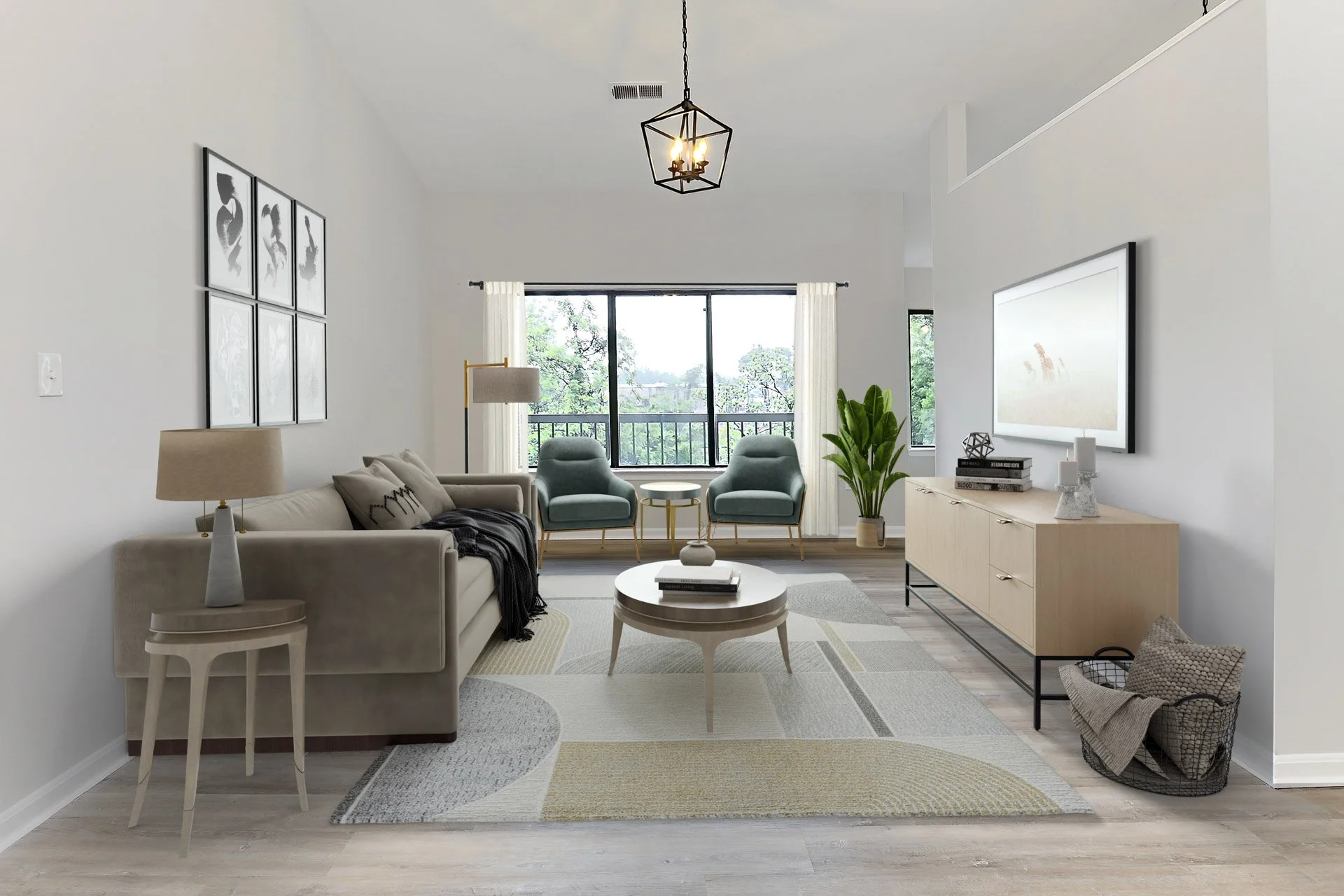 Modern living room with beige sofa, two blue armchairs near a large window, a white coffee table, and an entertainment console with a flat-screen TV. Decor includes a framed wall art, table lamps, and potted plant.