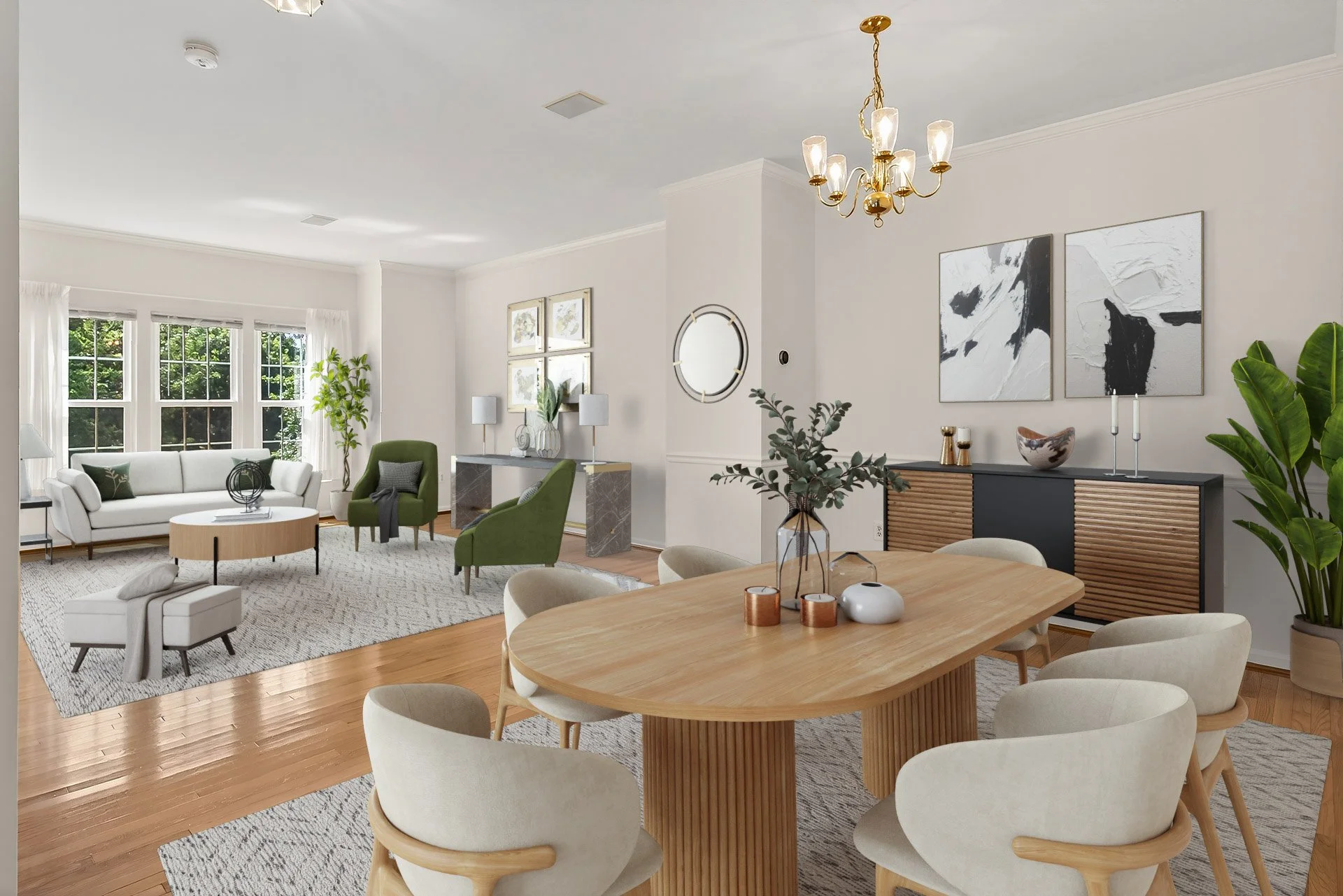 A spacious living and dining room with hardwood floors, large windows with white curtains, a white sofa, green armchairs, a round coffee table, a beige rug, a wooden dining table with white chairs, decorative lamps, abstract artwork, and houseplants.