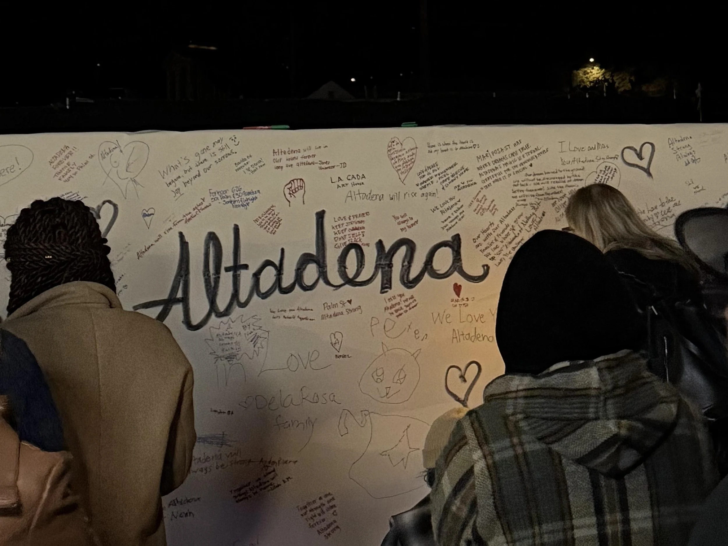Wall of well wishes and notes for Altadena fire survivors.