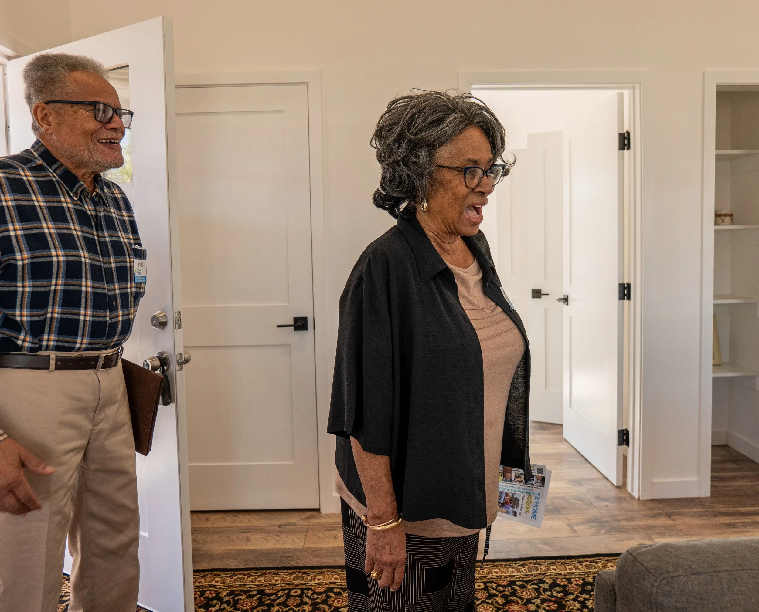 Carol and Ken Wood enter their new home for the first time - look of delight.