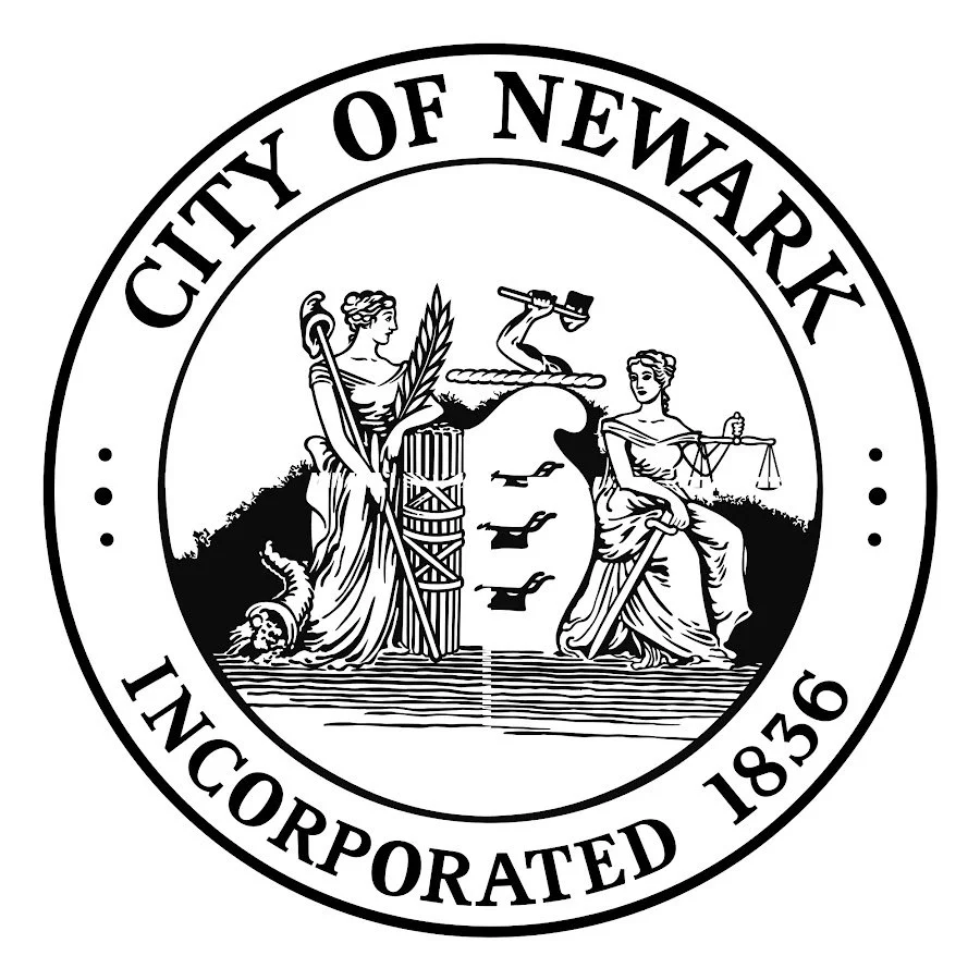 Seal of the City of Newark with graphic emblems and text.