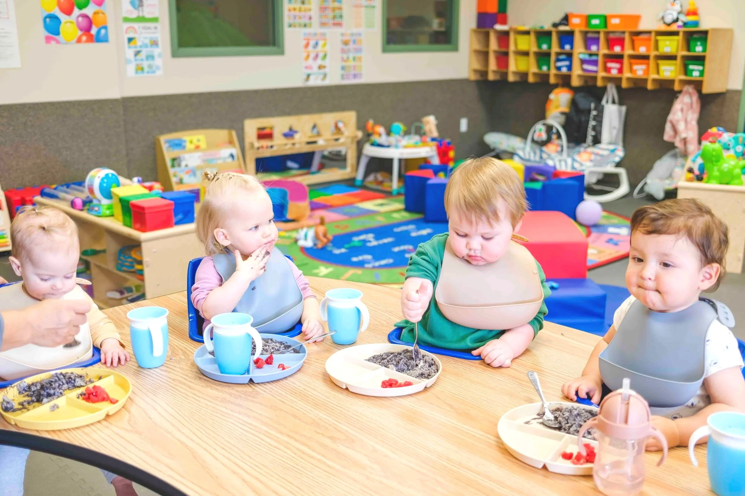 Infants enjoying mealtime at Agape bilingual daycare in Hugo MN