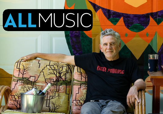 Rob Miller sitting on sofa with AllMusic logo overlay