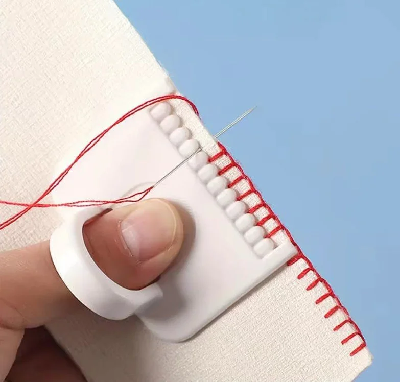 Guide à point de feston pour couture à la main