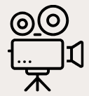 A simple line drawing of a vintage film camera on a tripod.