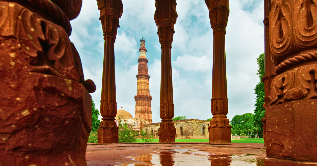 Qutab Minar rising above Alai Darwaza and the surrounding monuments in Mehrauli, Delhi