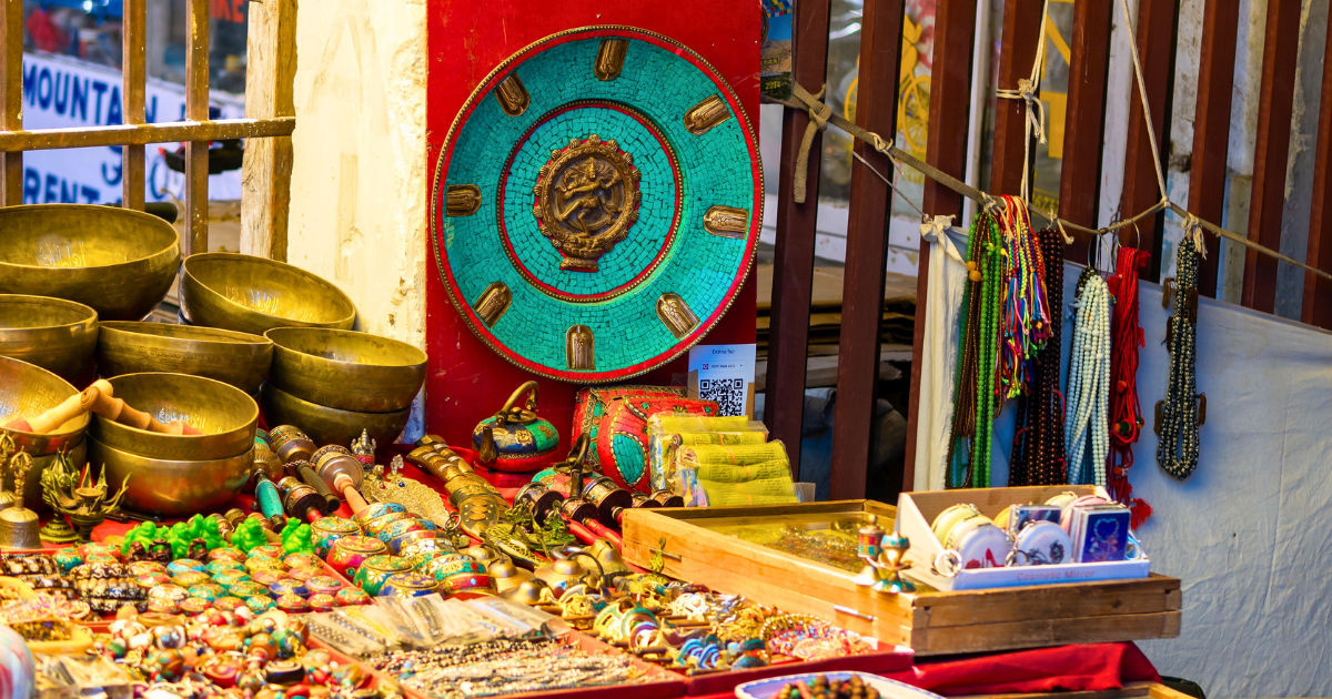 Market stall in Leh with singing bowls, turquoise mandala, prayer beads and Tibetan jewellery