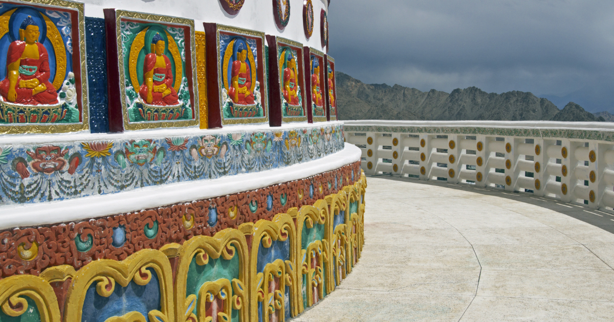 Painted Buddha panels and walking path around the Shanti Stupa in Leh