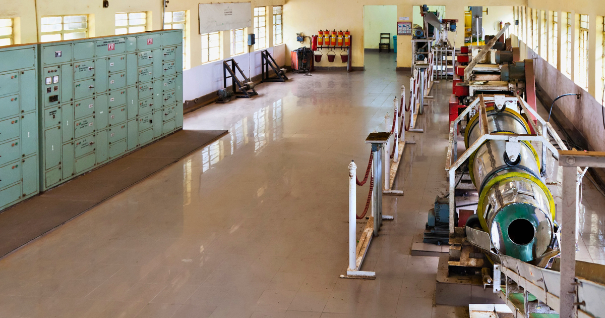 Tea processing machinery and rollers inside the Munnar Tea Museum factory area