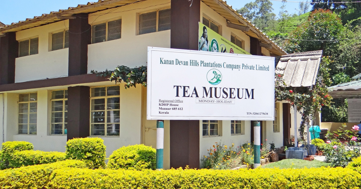 Signboard at the entrance to the Kanan Devan Hills Plantations Tea Museum in Munnar