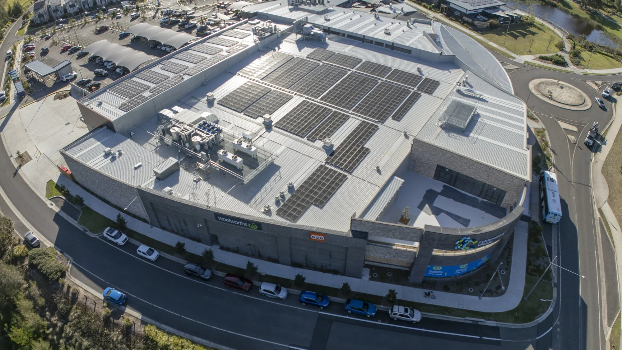 Drone photo of Calderwood village shopping complex from the air taken by Altitude Cinema