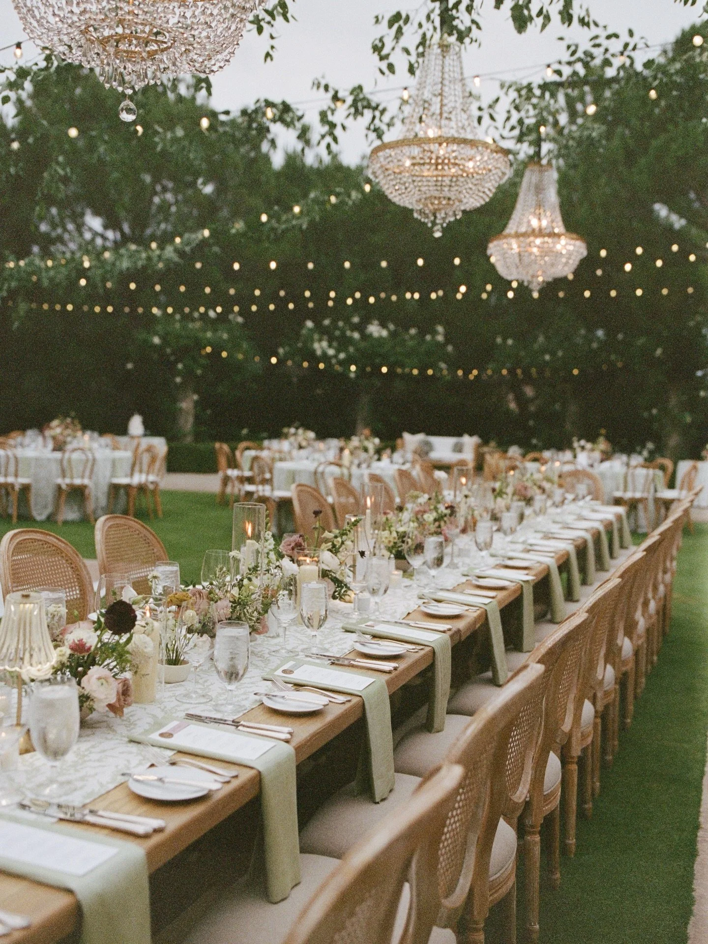 A beautifully layered California reception for L&amp;M, featuring linen-textured menus at each place setting, linen bar and welcome signage, deckle-edge table numbers, and their wedding crest woven throughout the space. An incredible vendor team brou