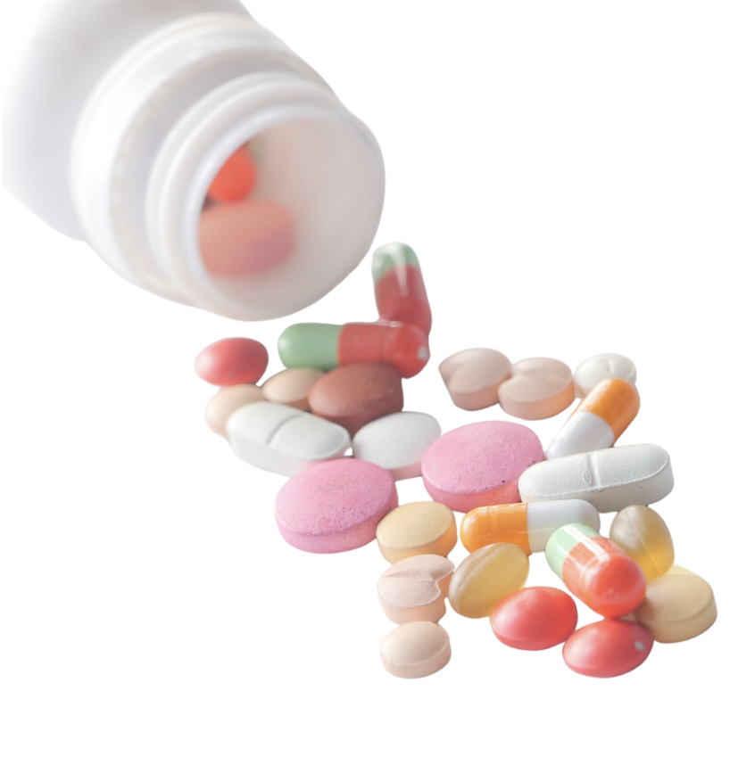 Une bouteille de médicaments avec des comprimés et capsules colorés tombant dessus.