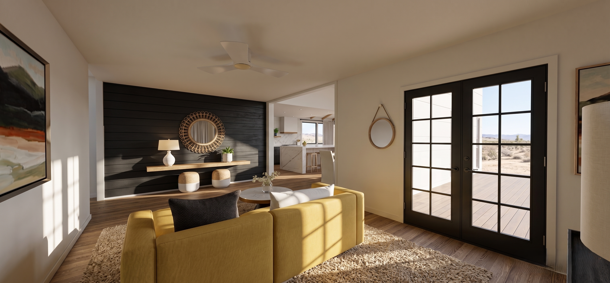 Living room with yellow sofa, round coffee table, black and white chair, dark wood accent wall, mirror, table lamp, paintings, large glass doors opening to a patio, desert landscape outside.