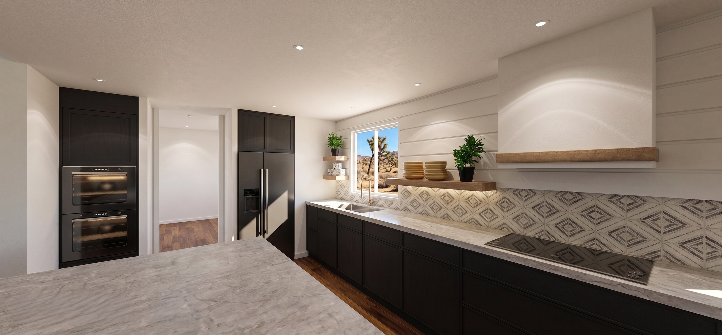 Modern kitchen with black cabinets, a marble countertop, a stainless steel refrigerator, oven, and a desert view through a window.