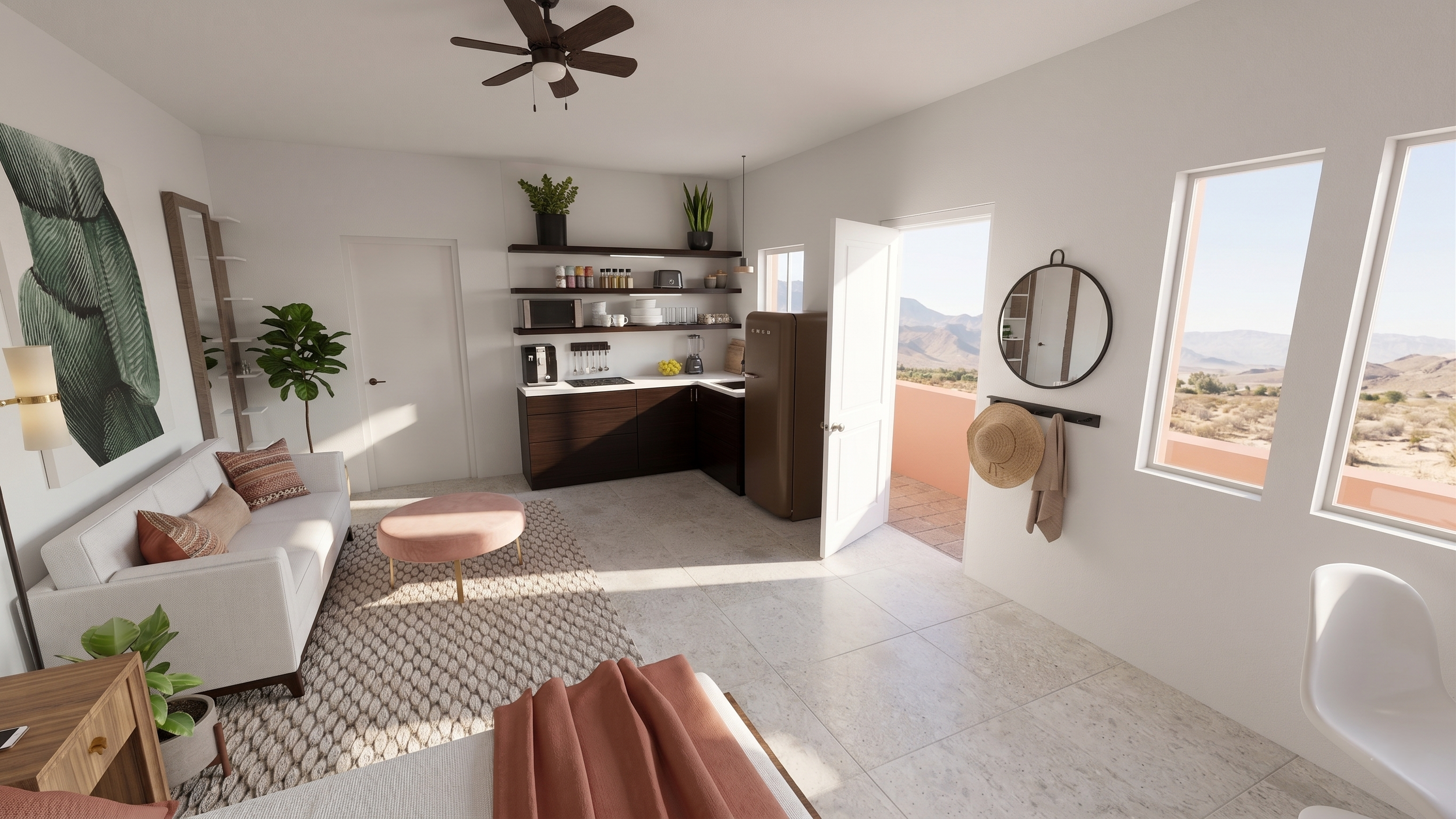 A cozy living room with white walls, a small beige sofa accented with rust-orange pillows, a pink round ottoman, a patterned rug, and indoor plants. The kitchen area has dark brown cabinets, open shelves with kitchen items, a microwave, and a refrige