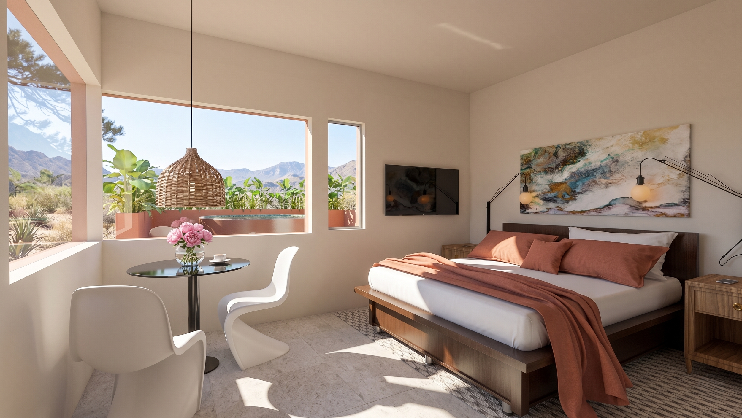 Bedroom with large windows showing mountain and desert landscape, bed with rust-colored bedding, artwork above the bed, wall-mounted TV, side table, and a table with a flower arrangement and teacup.