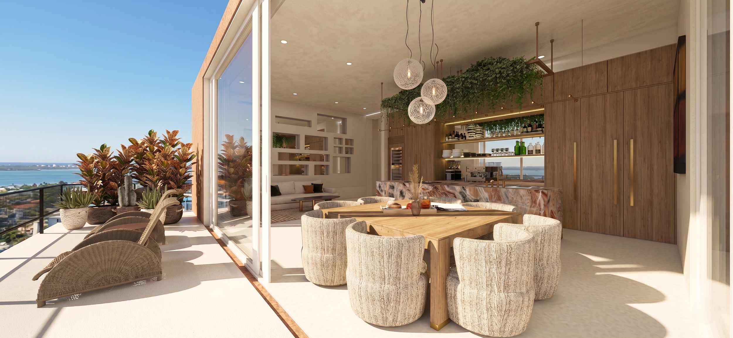 Interior of a modern apartment with an open layout, featuring a dining area with a wooden table and beige upholstered chairs, a bar with green bottles and glassware, and a seating area with a sofa. Large glass sliding doors open to a balcony with pot