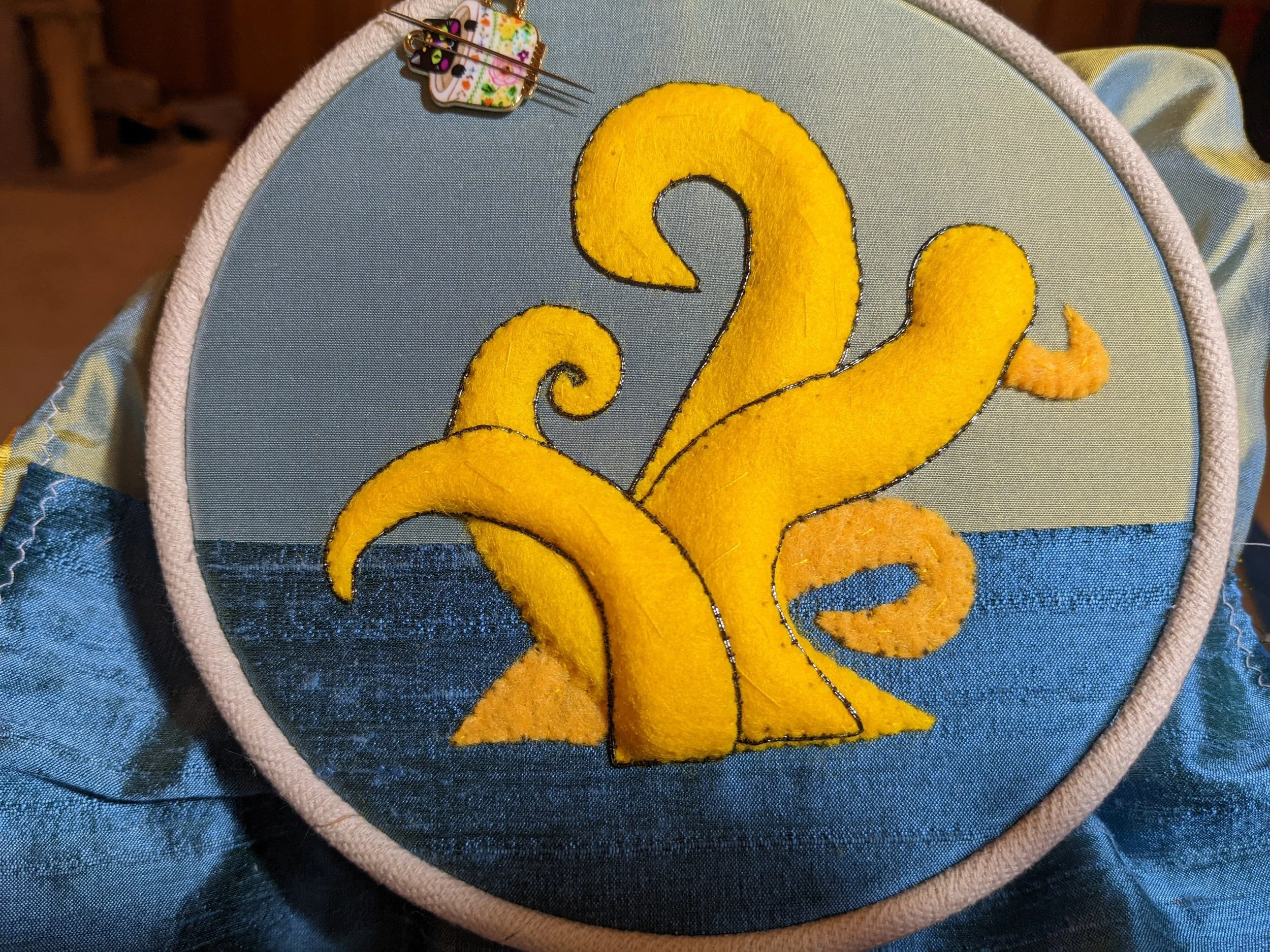 Layers of felt padding sewn to silk.
