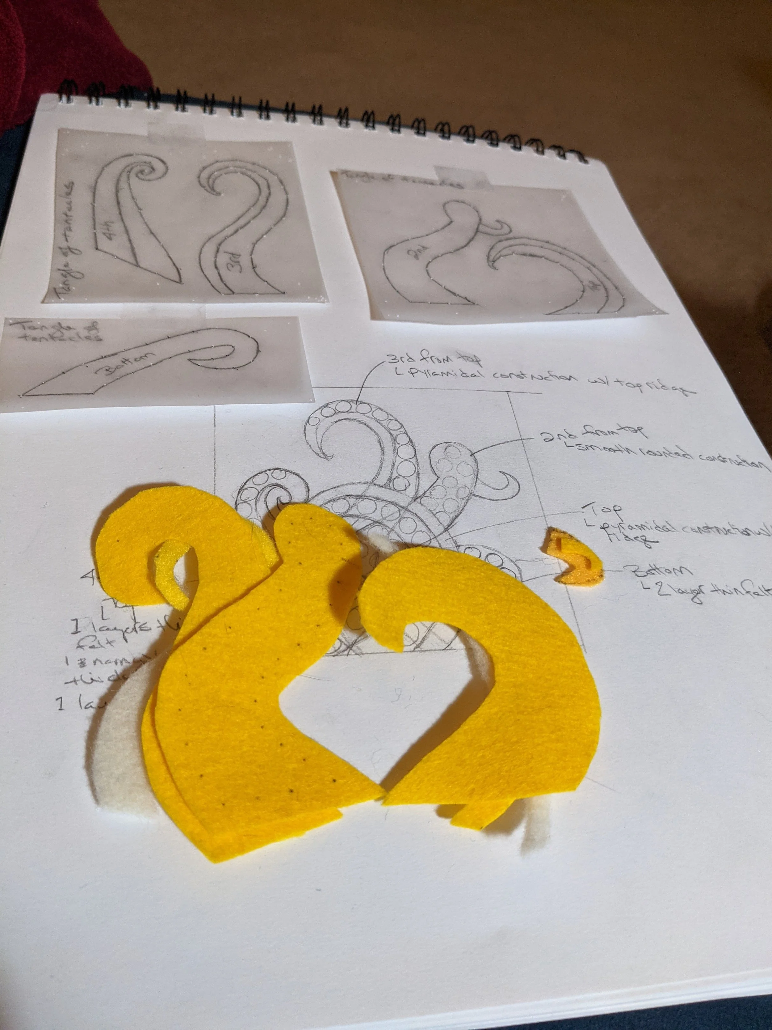 Drawings and cut-out felt padding.