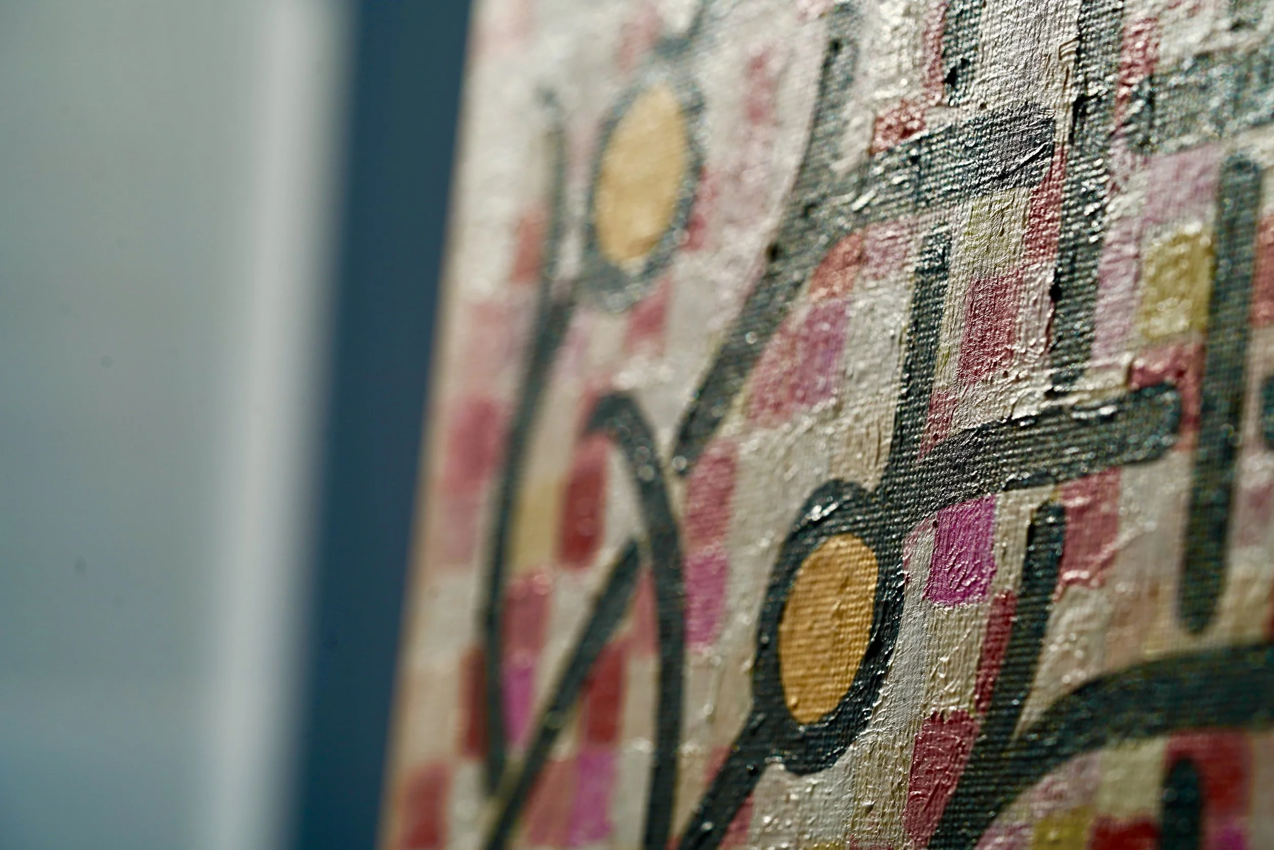 Close-up of an abstract textured painting by Peter Gil  titled "Generations" with various colours and curved lines.