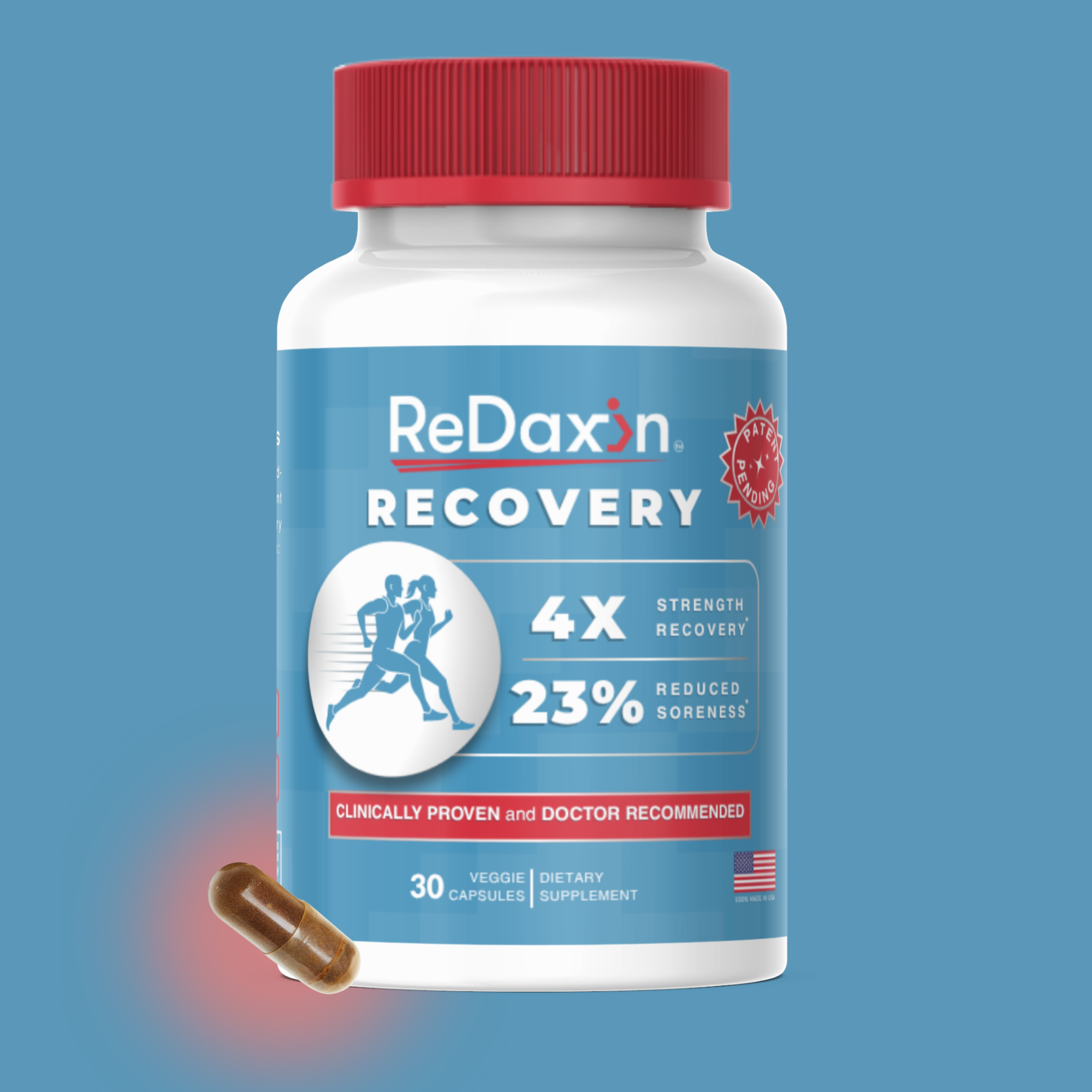 A bottle of ReDaxin Recovery dietary supplement with the cap visible, a capsule is near the bottle, and the label indicates it promotes recovery, reduces soreness, and is made in the USA.